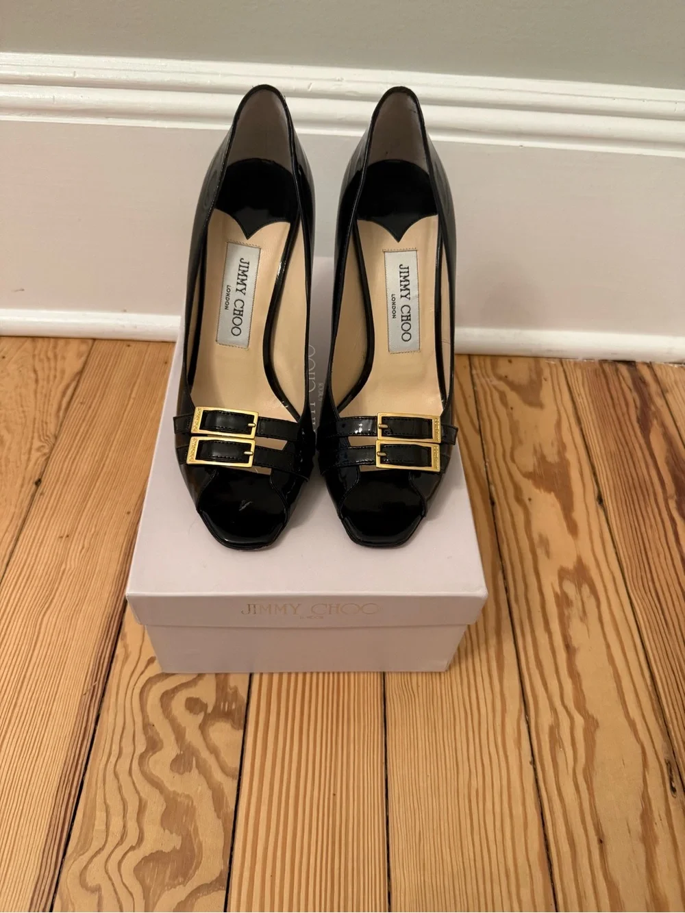 Jimmy Choo Black Patent Leather Peep-Toe Pumps with Gold Buckles